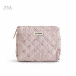 Trousse de toilette rose pâle avec motifs nœuds