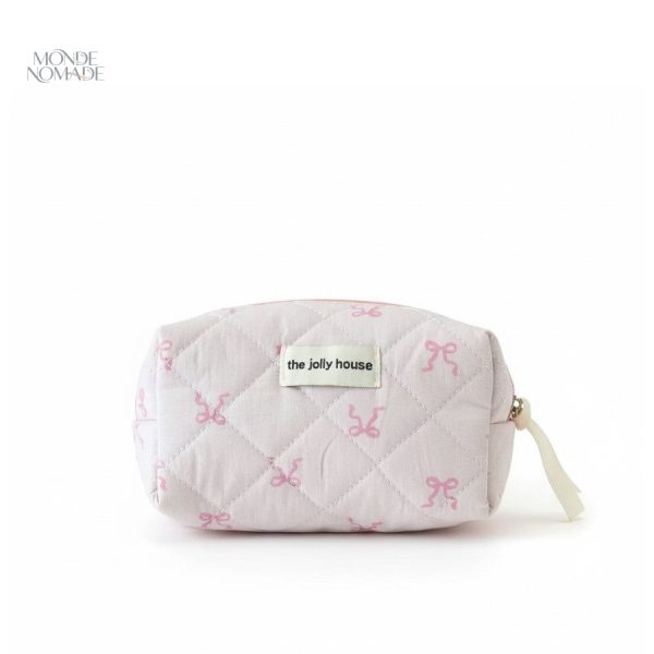 Accessoire de voyage rose pâle pour soins
