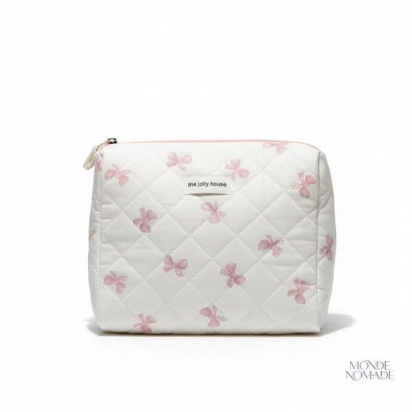 Trousse de toilette en tissu matelassé motifs nœuds papillon