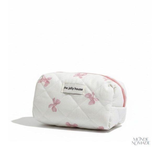 Trousse de toilette motifs nœuds papillon en tissu matelassé