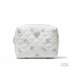 Trousse de toilette élégante en tissu matelassé avec nœuds papillon