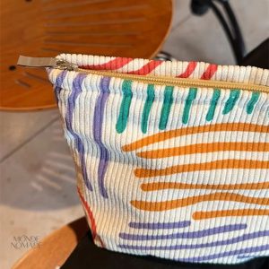 Trousse de toilette en velours à rayures multicolores
